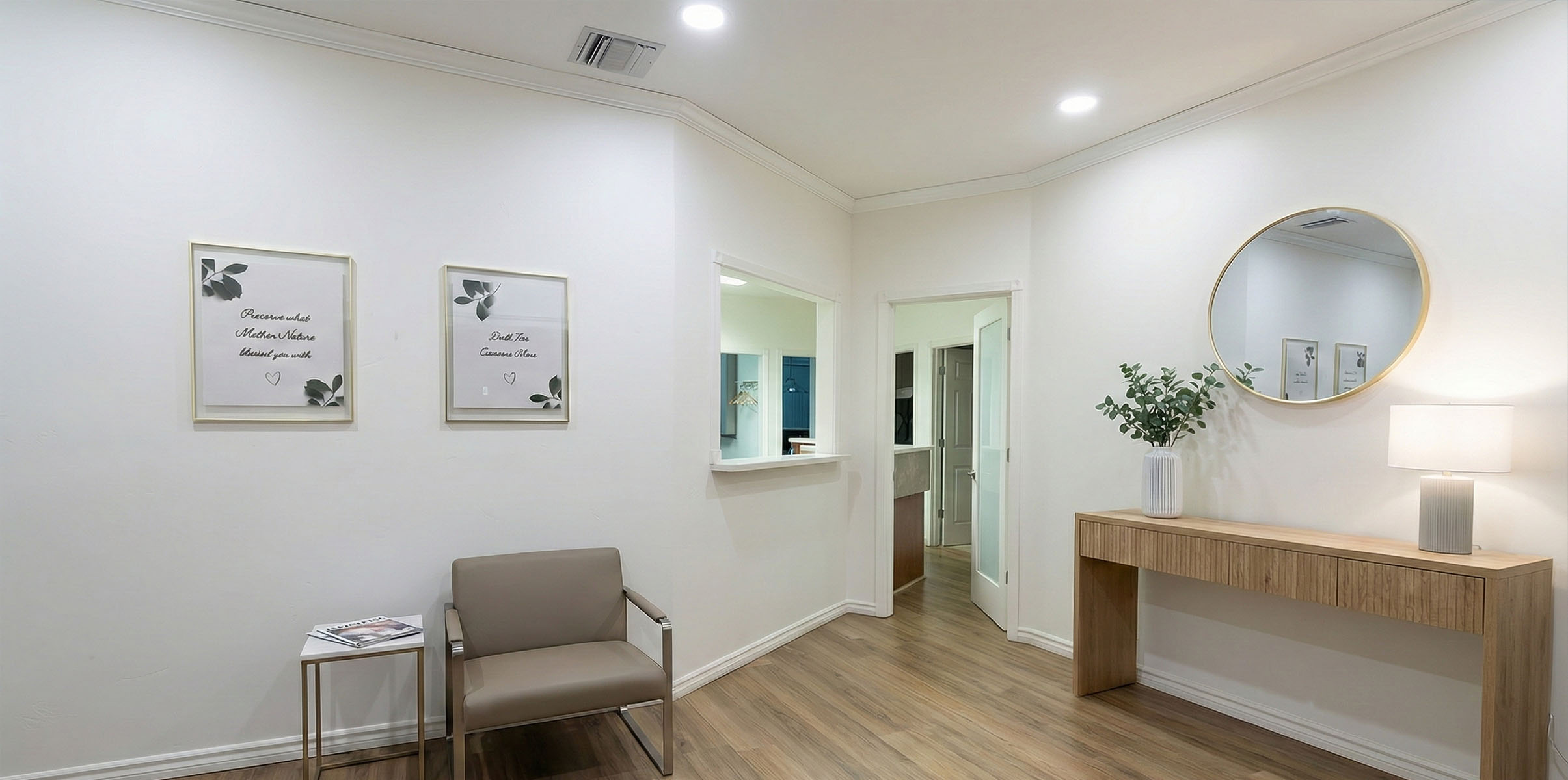 A modern dental practice with a blue and white chair, a dental treatment table, and medical equipment.